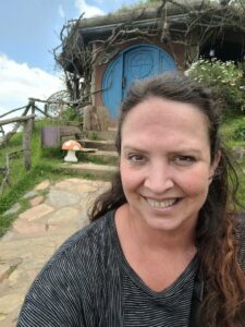 Julie in front of a Hobbit hole at Hobbitenango Antigua, Guatemala