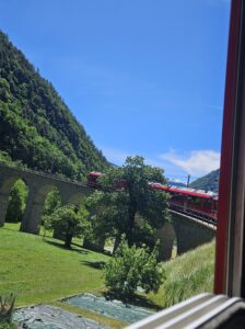 The Bernina Express red train on the Brusio spiral viaduct