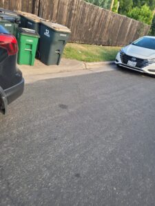 Trash can blocked "accessible" side entrance (kept locked) at an Austin, TX cafe