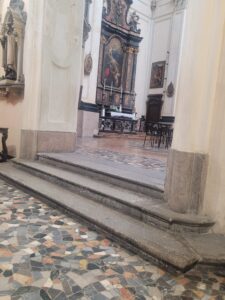 Church sanctuary entrance inside San Bernardino alle Ossa