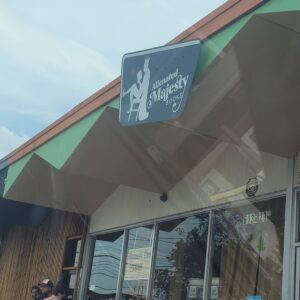 Front sign at Alienated Majesty Books